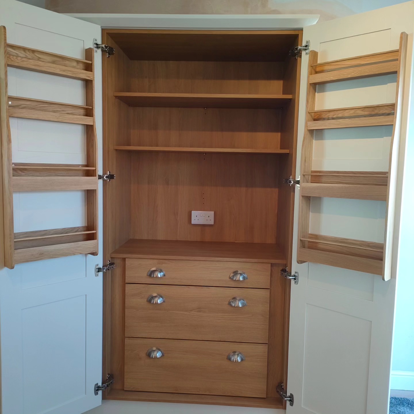 Painted larder cupboard with an oak interior, door racks and drawers